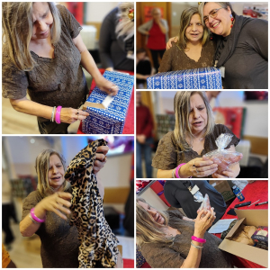 Rozdawanie prezentów na oddziale 3A. Mieszkanka pozuje do zdjęcia z podarunkami od Mikołaja.